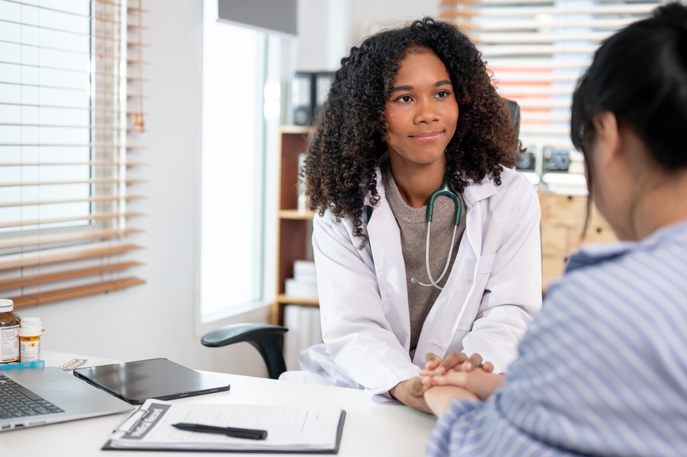 doctor talking to female patient.