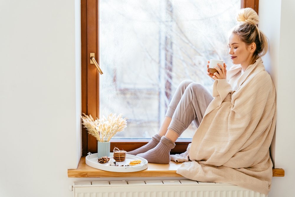 woman cozy in blanket.