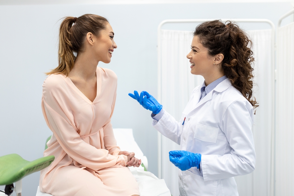 woman smiling at doctor.