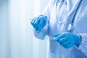Doctor holding pap test. 