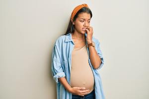worried pregnant woman.