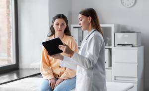 woman talking to doctor.