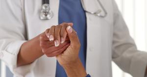 doctor comforting woman. 
